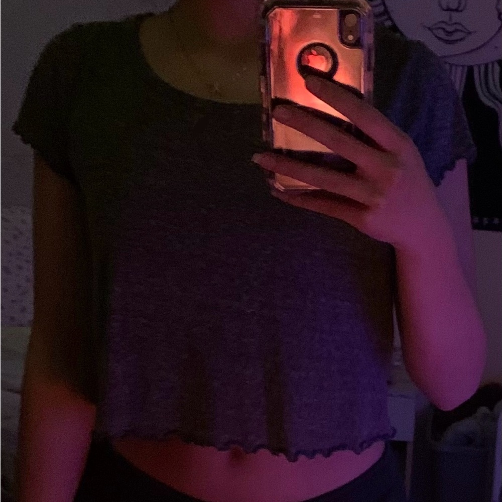 | Grey Crop Top | Ruffle edges on sleeves and bottom | Loose |